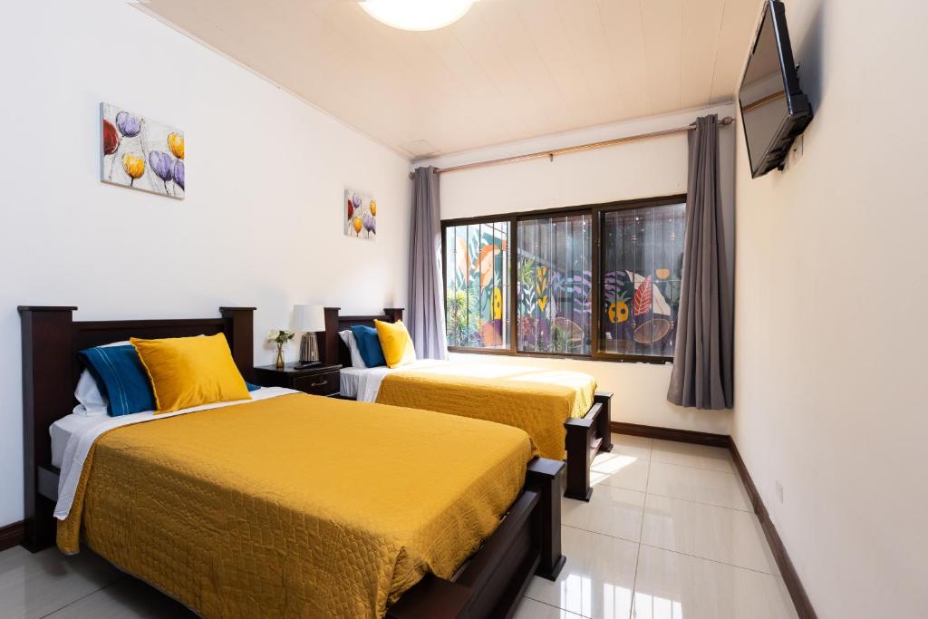 Postel nebo postele na pokoji v ubytování Viva Guest House