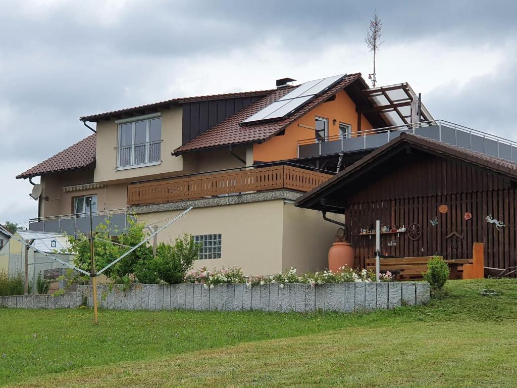 a house with a solarium on top of it at Comfortable flat in Görwihl with balcony in Görwihl