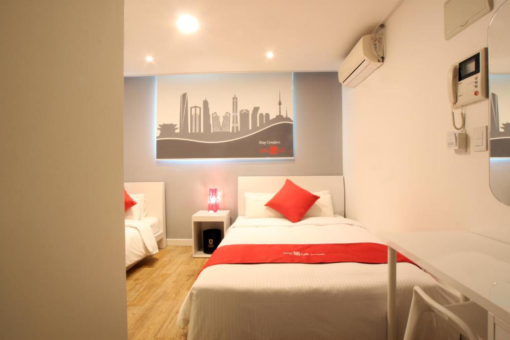 Postel nebo postele na pokoji v ubytování Jn Park Hotel Dongdaemun