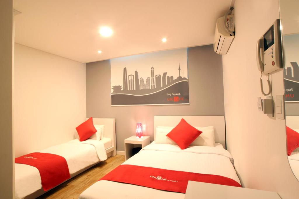 Postel nebo postele na pokoji v ubytování Jn Park Hotel Dongdaemun