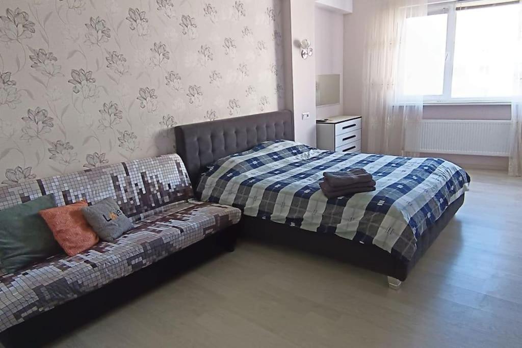 Ένα ή περισσότερα κρεβάτια σε δωμάτιο στο Apartament stilat!