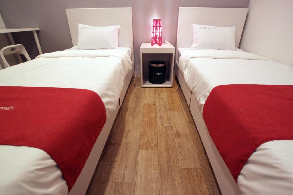 Postel nebo postele na pokoji v ubytování Jn Park Hotel Dongdaemun