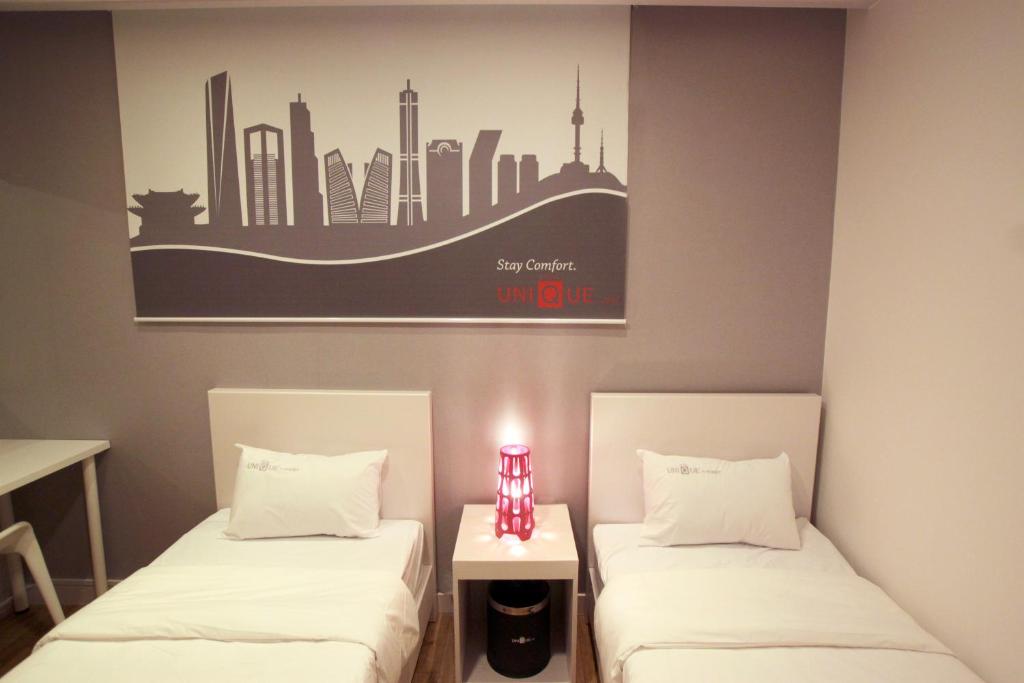 Postel nebo postele na pokoji v ubytování Jn Park Hotel Dongdaemun