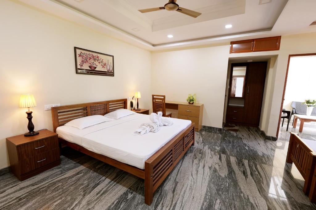 Postel nebo postele na pokoji v ubytování Metropolitan Serviced Villa