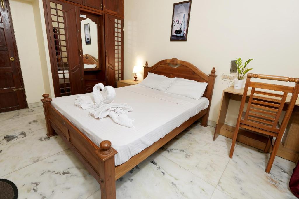 Postel nebo postele na pokoji v ubytování Metropolitan Serviced Villa