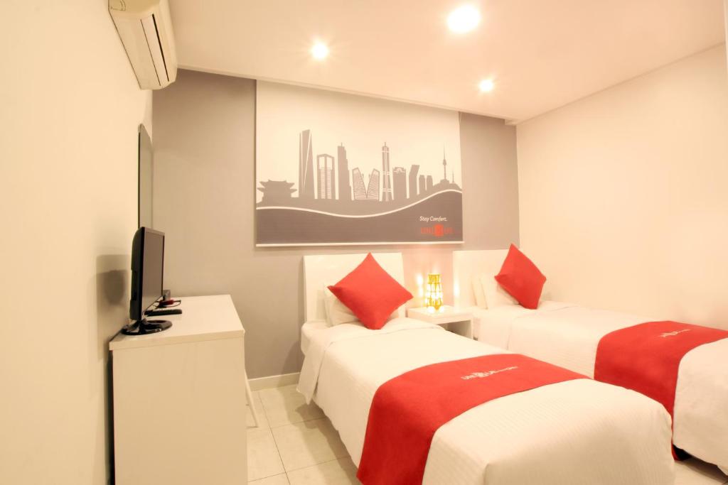 Postel nebo postele na pokoji v ubytování Jn Park Hotel Dongdaemun