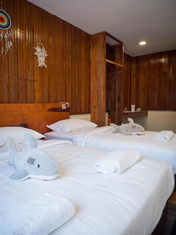 Timba Garden FREE TOWN AND JETTY TRANSPORT客房内的一张或多张床位