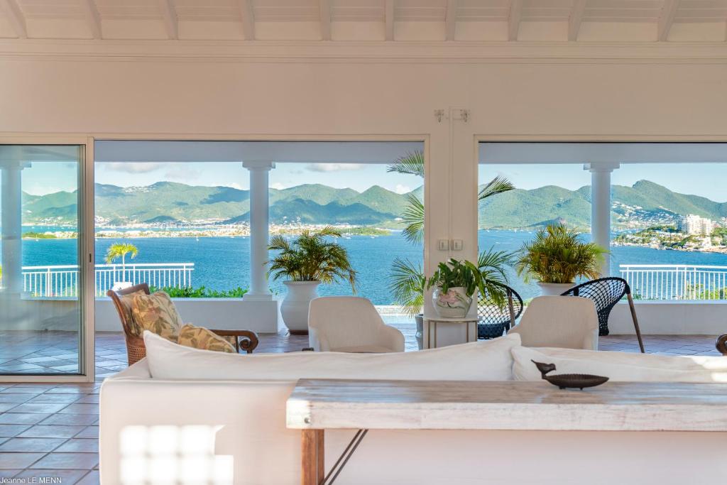 a living room with a view of the ocean at O SUN in Les Terres Basses