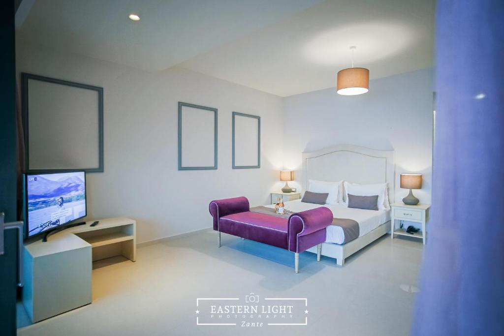 Postel nebo postele na pokoji v ubytování Balcony Boutique Hotel