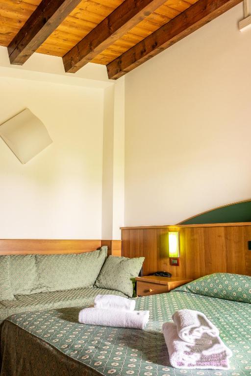Postel nebo postele na pokoji v ubytování B&B Hotel Roy