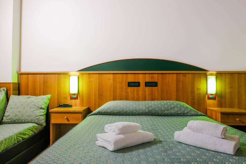 Postel nebo postele na pokoji v ubytování B&B Hotel Roy