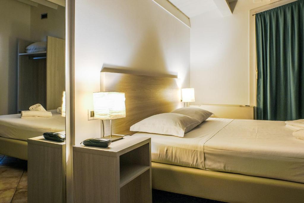 Postel nebo postele na pokoji v ubytování B&B Hotel Roy