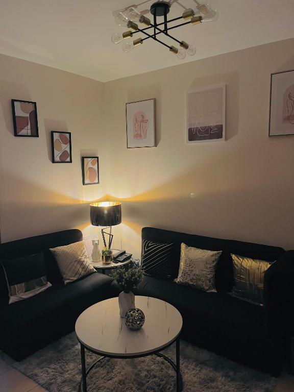 a living room with a couch and a table at 8 Spatial Condo in Davao City