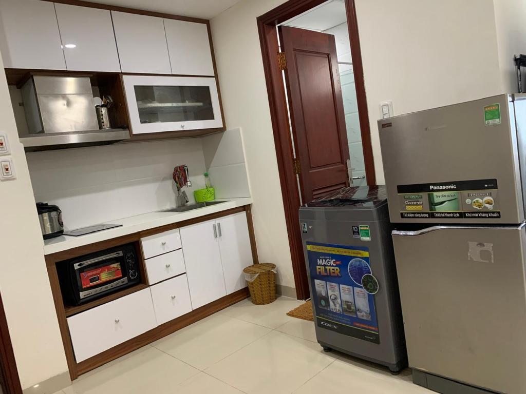 Kuchyň nebo kuchyňský kout v ubytování Salamander Apartment hotel