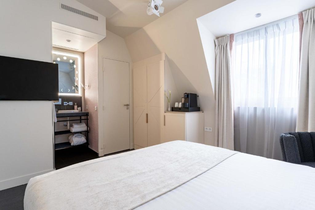 Postel nebo postele na pokoji v ubytování Hotel Astra Opera - Astotel