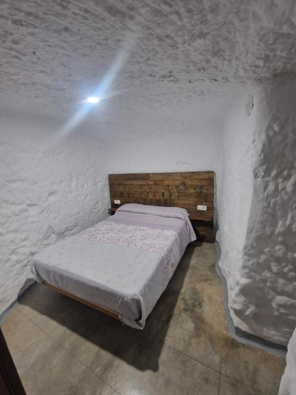 Postel nebo postele na pokoji v ubytování Cueva de David
