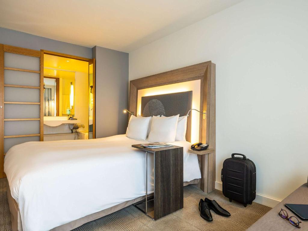 Postel nebo postele na pokoji v ubytování Novotel Mechelen Centrum
