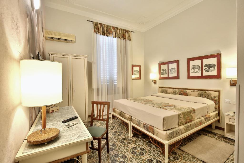 Posteľ alebo postele v izbe v ubytovaní MADAMA GUEST HOUSE