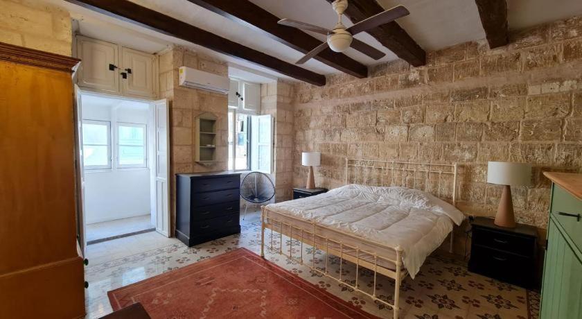 Postel nebo postele na pokoji v ubytování Mulberry Suites