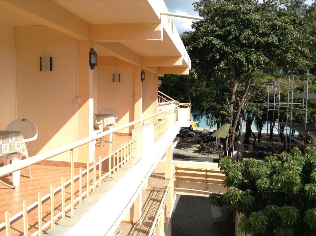 a view of the balcony of a building at Ebrahim Flats - Grand Baie Beach in Grand-Baie
