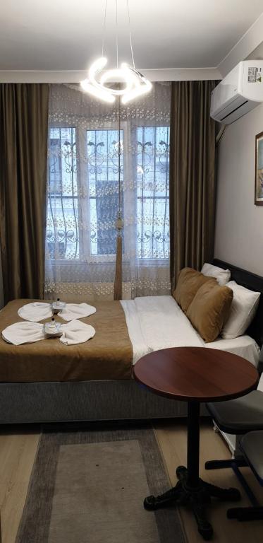 Postel nebo postele na pokoji v ubytování Taksim Millennium Suit Hotel