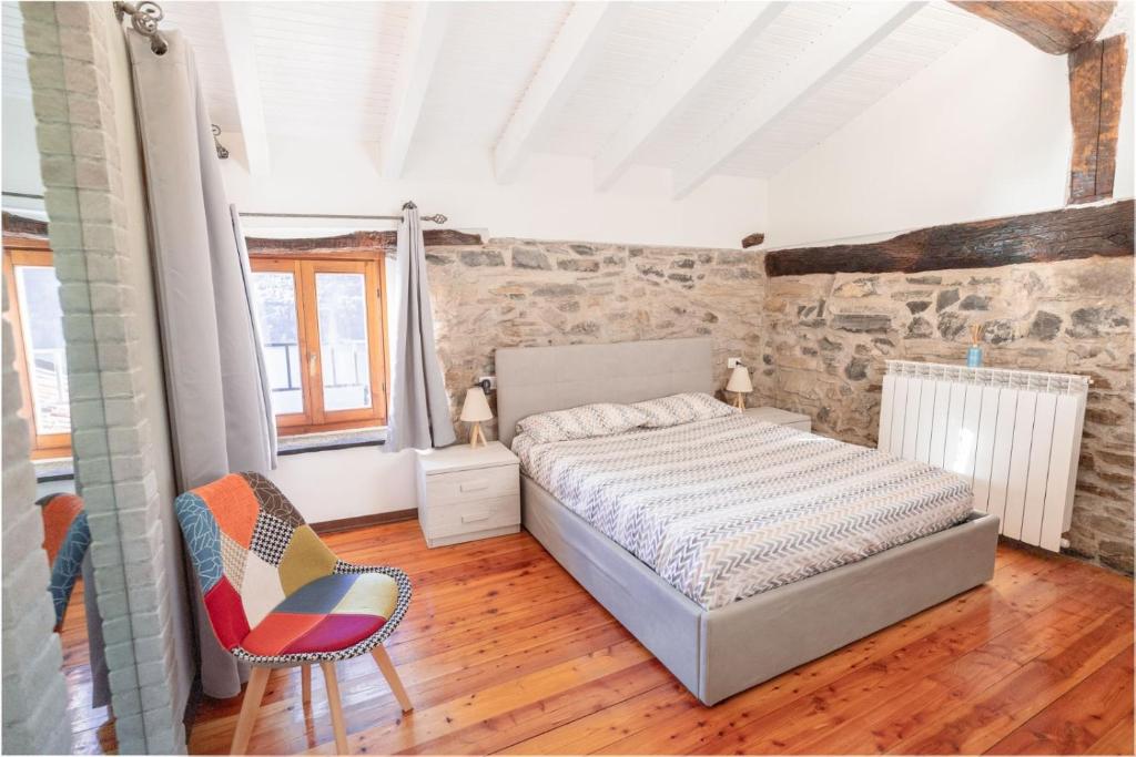 Postel nebo postele na pokoji v ubytování Il rustico DN ART holidays home - alloggio tipico