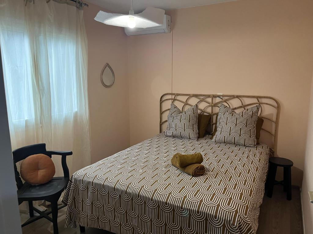 Postelja oz. postelje v sobi nastanitve Aprile des îles .Appartement avec une jolie vue