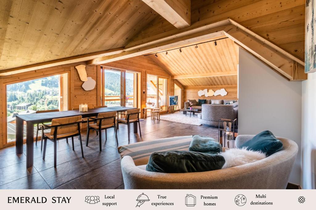 een woonkamer met een tafel en een bank bij Apartment Tahoe Les Gets - by EMERALD STAY in Les Gets