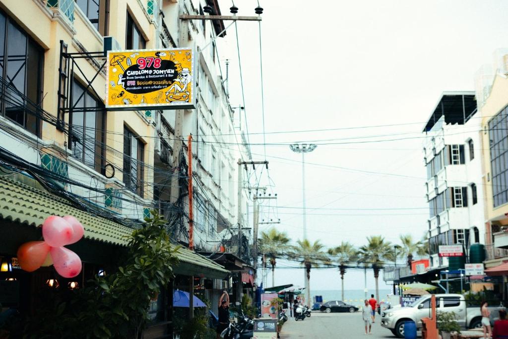a street with a sign on the side of a building at 978 CHIDLOM at JOMTIEN in Jomtien Beach