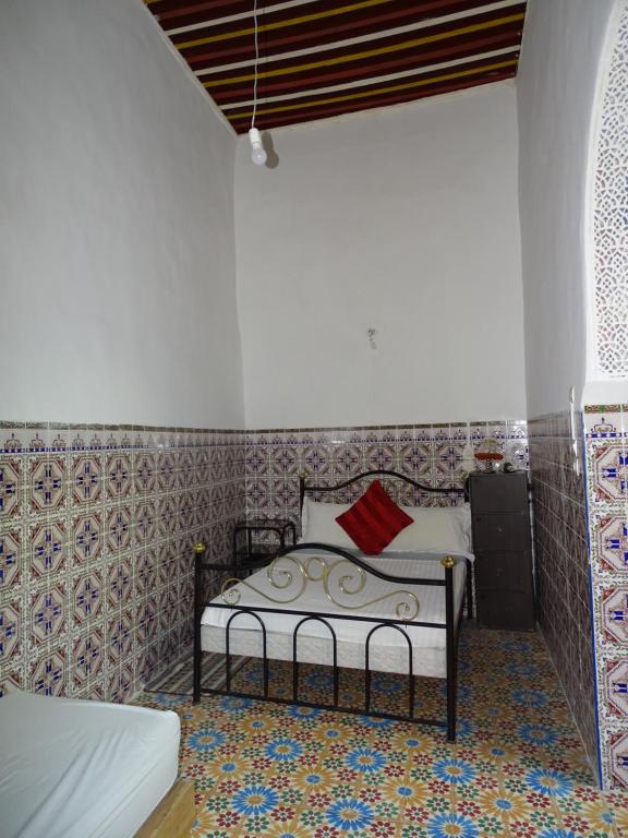 Postel nebo postele na pokoji v ubytování Riad Amimi Fes