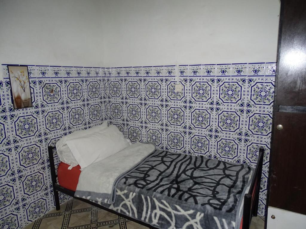 Postel nebo postele na pokoji v ubytování Riad Amimi Fes