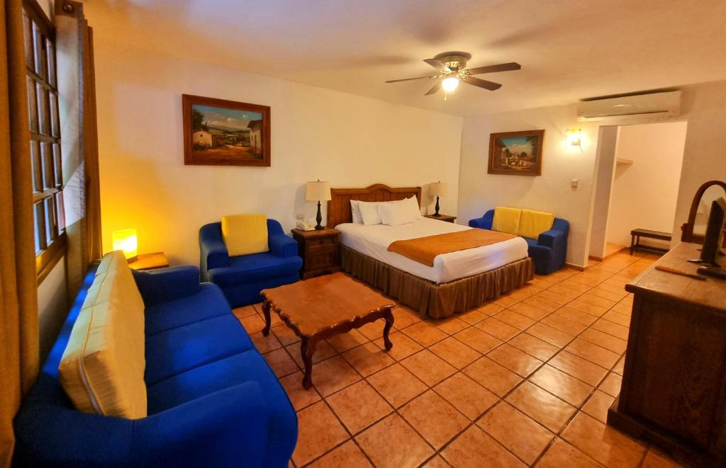 Postel nebo postele na pokoji v ubytování Hotel Holly