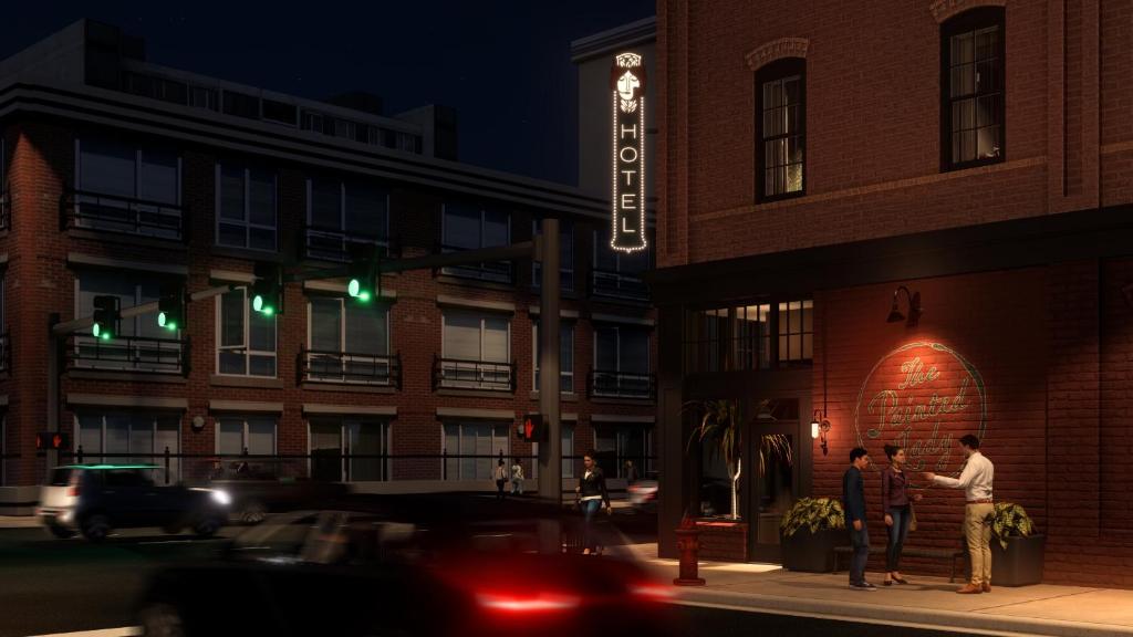 a group of people standing outside of a building at night at The Painted Lady in Birmingham