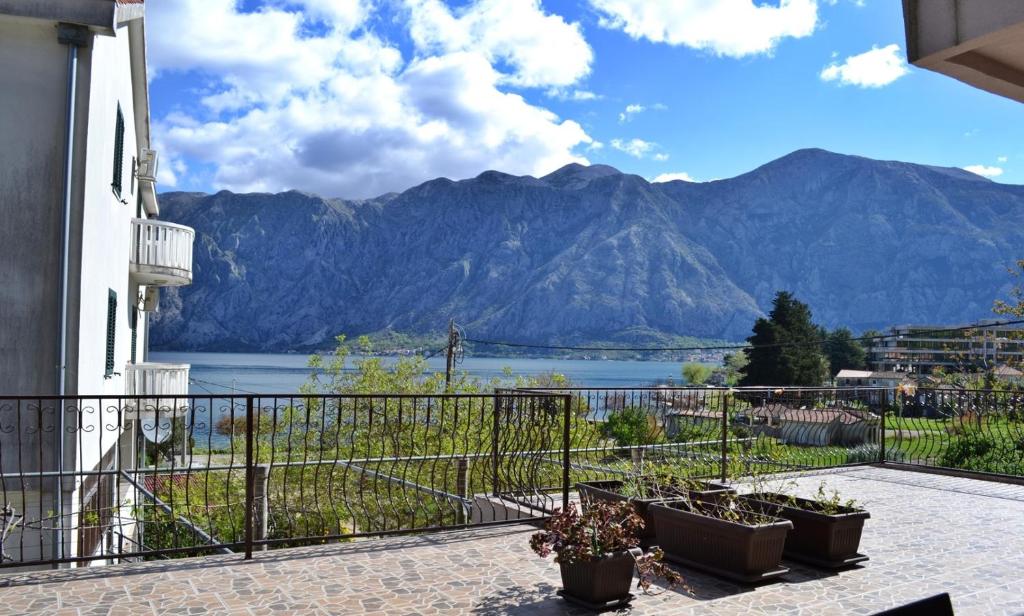 a balcony with a view of a lake and mountains at Apartments Sevaljevic in Kotor