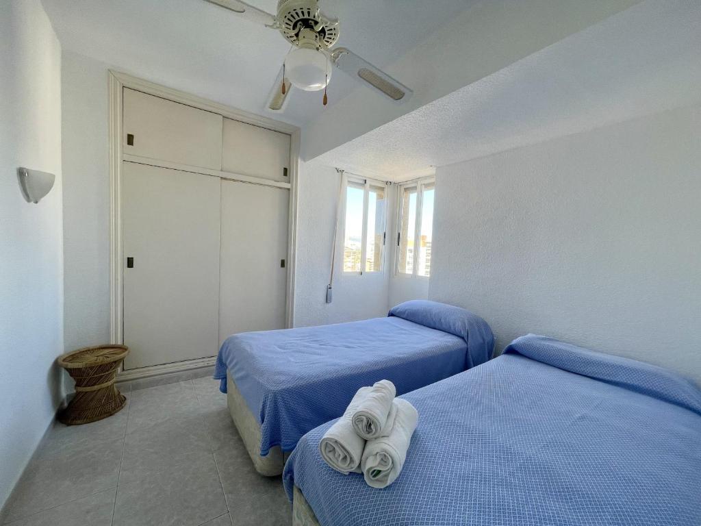 A bed or beds in a room at Caballos Apartment