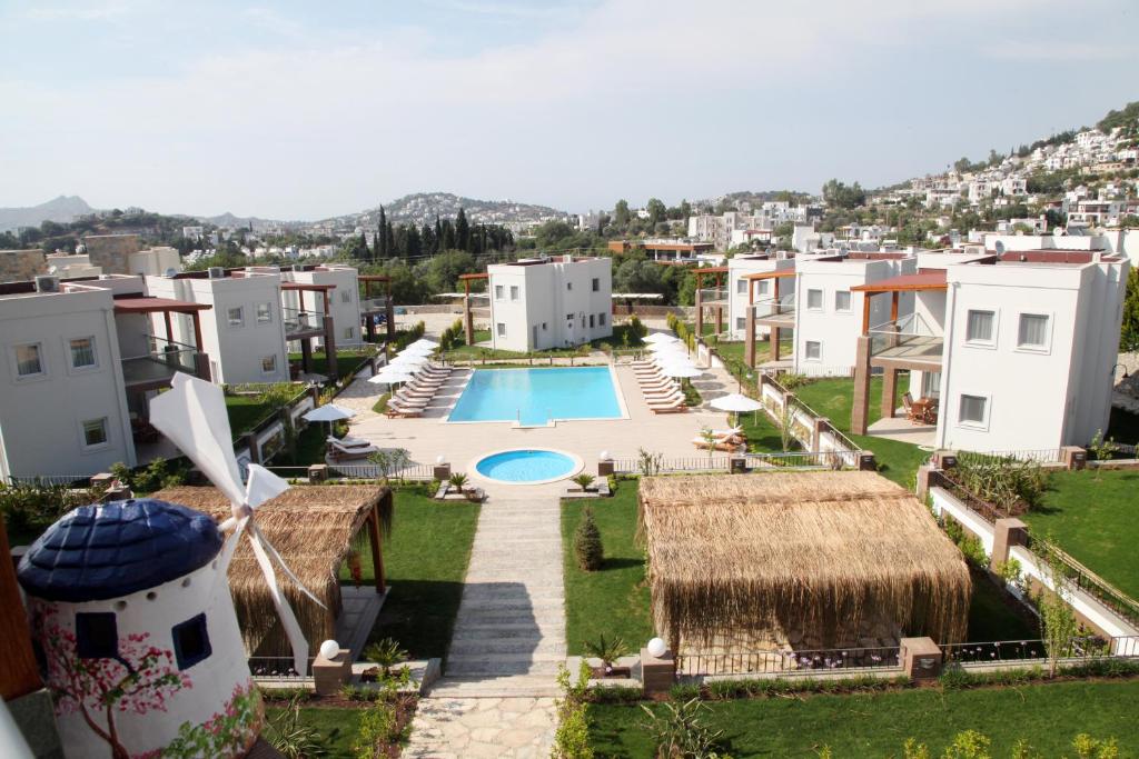 a view of a resort with a pool and buildings at Dibek Homes Villa & Hotel in Yalıkavak
