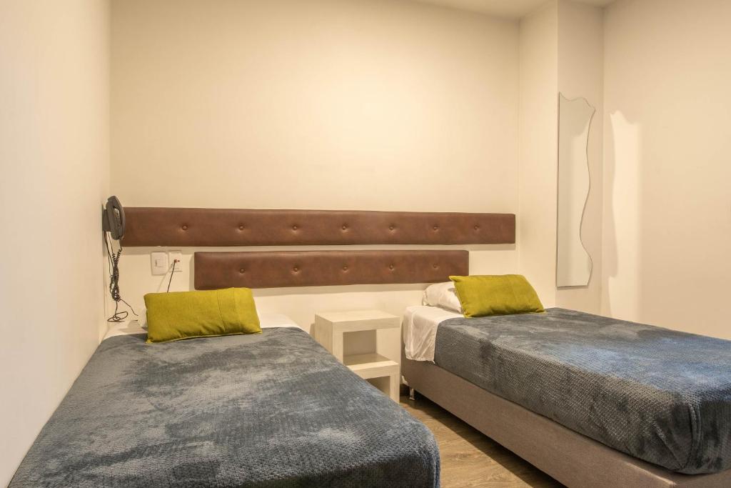 Postel nebo postele na pokoji v ubytování Hotel Wess