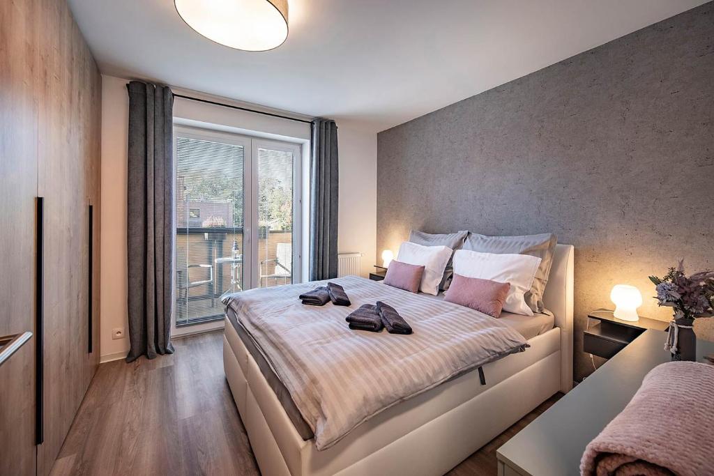 Postel nebo postele na pokoji v ubytování Apartments Centrum Hviezdoslav