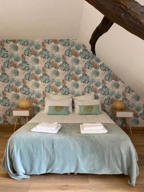 Postel nebo postele na pokoji v ubytování La Charmeraie : gîte de charme, piscine et spa