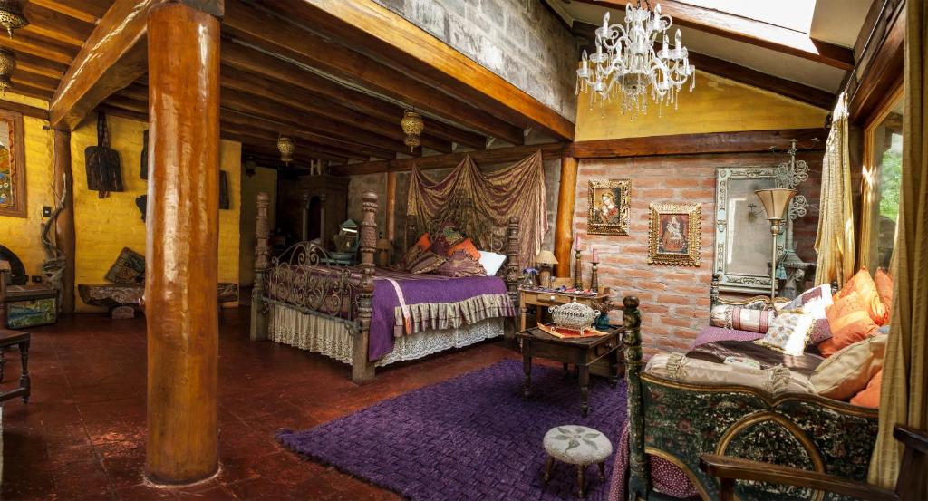 Postel nebo postele na pokoji v ubytování Hacienda Rumiloma