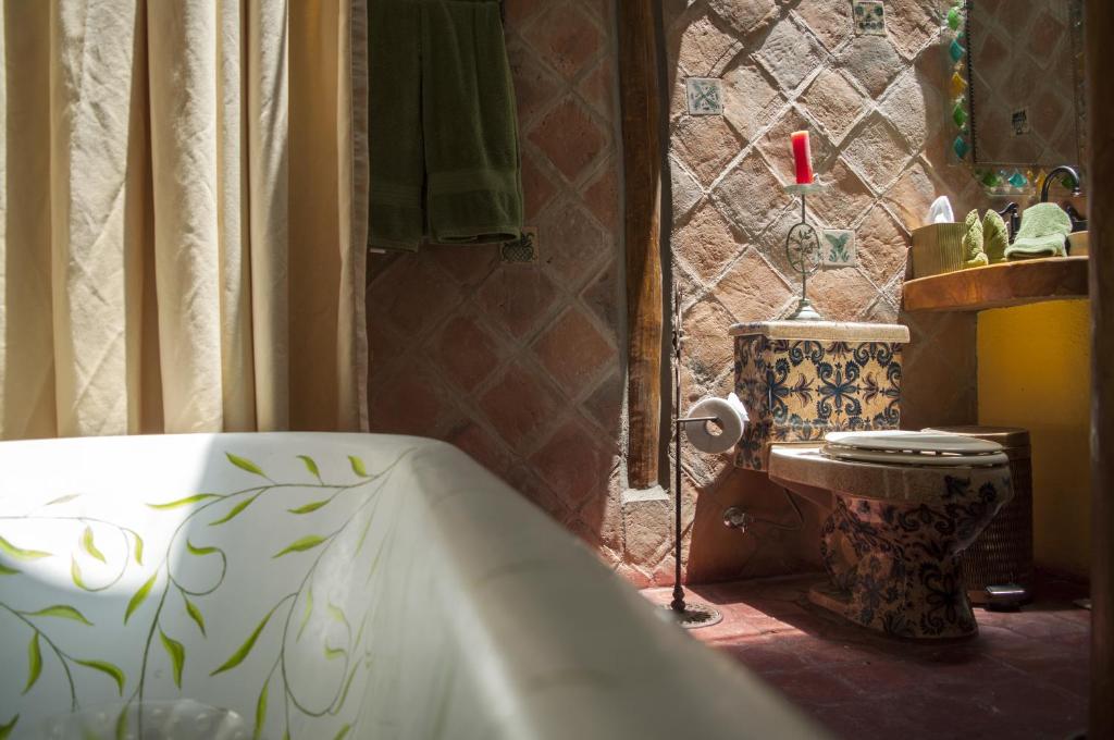 Postel nebo postele na pokoji v ubytování Hacienda Rumiloma