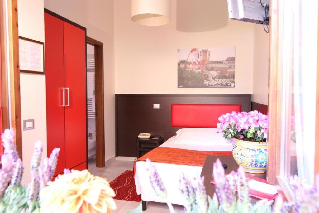 Postel nebo postele na pokoji v ubytování Hotel al Corso