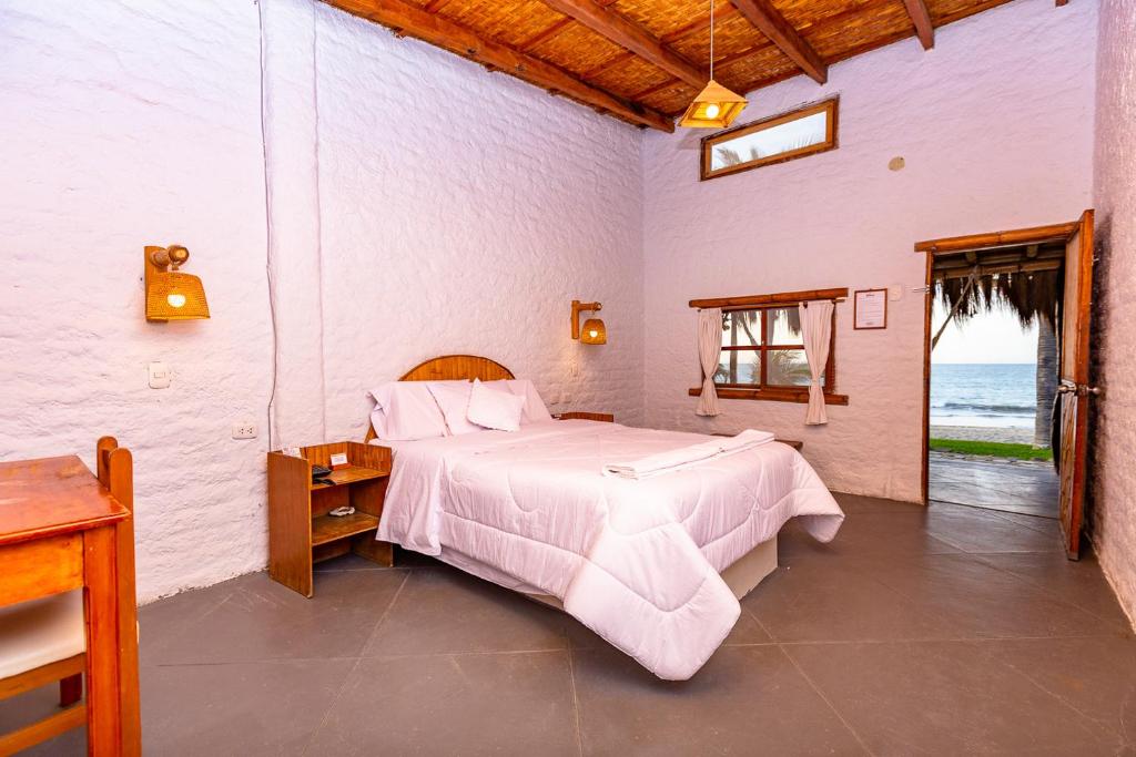 Postel nebo postele na pokoji v ubytování Hotel Las Pocitas