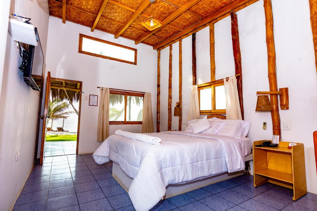 Postel nebo postele na pokoji v ubytování Hotel Las Pocitas