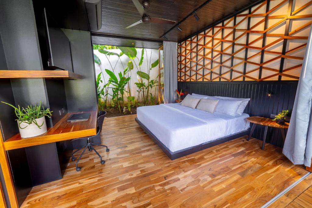 Postel nebo postele na pokoji v ubytování Danta Santa Lofts
