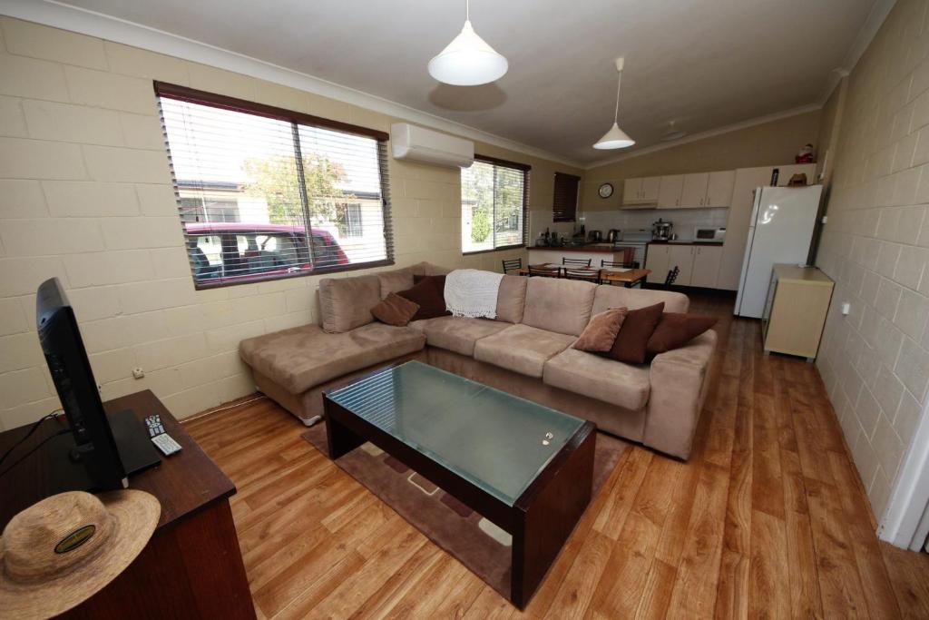 a living room with a couch and a table at Beach Unit 7 at Hat Head in Hat Head