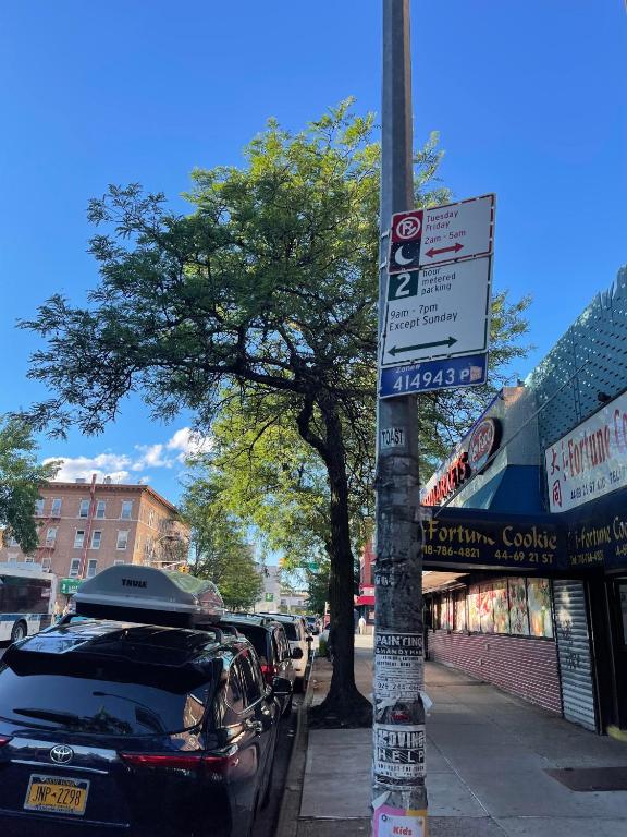 a car parked on a sidewalk next to a street at 2 Bedrooms apartament one stop from Manhattan in Weehawken