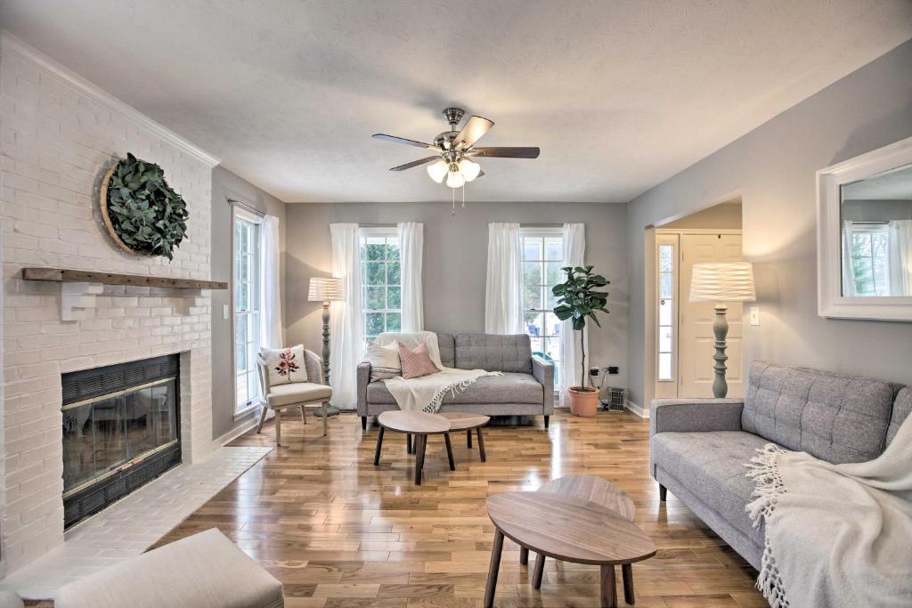 a living room with a couch and a fireplace at Cheval Circle Getaway Near Blue Ridge & Wine in Afton