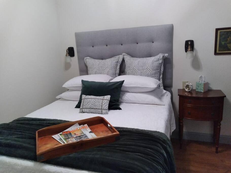 a bedroom with a bed with a tray on it at Cozy Getaway in Lincoln! 