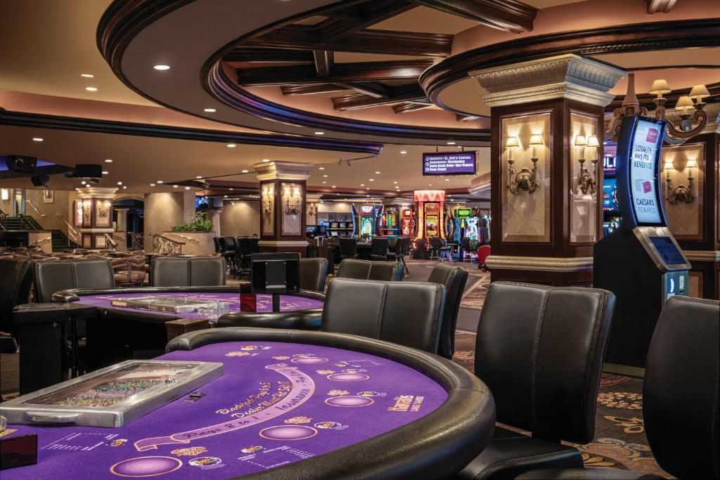 a casino with a bunch of poker tables at Harrah's Lake Tahoe Hotel & Casino in Stateline